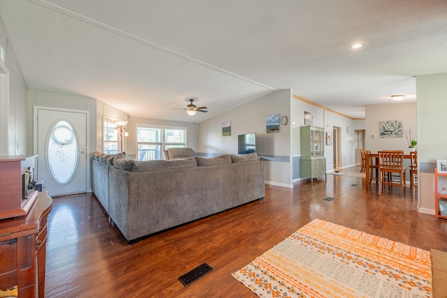 living room featuring vaulted ceiling and dark hardwood / wood-style flooring