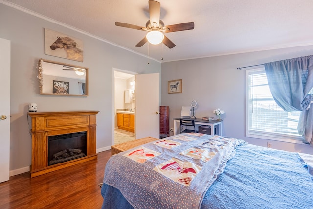 bedroom with ceiling fan, wood-type flooring, ensuite bath, and ornamental molding