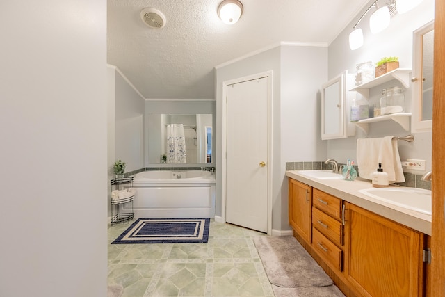 bathroom featuring vanity, a bathtub, crown molding, and a textured ceiling