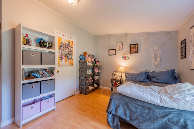 bedroom with light hardwood / wood-style floors