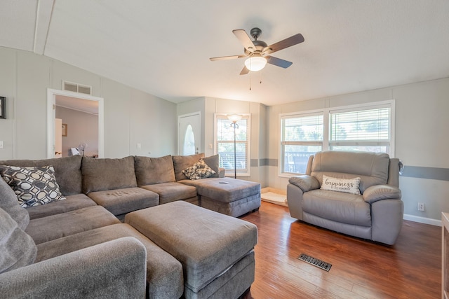 living room featuring hardwood / wood-style floors and ceiling fan