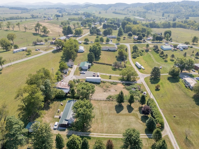 drone / aerial view with a mountain view and a rural view