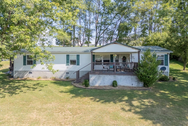 view of front of property with covered porch and a front yard