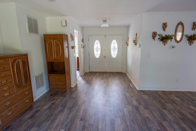 foyer entrance with dark wood-type flooring