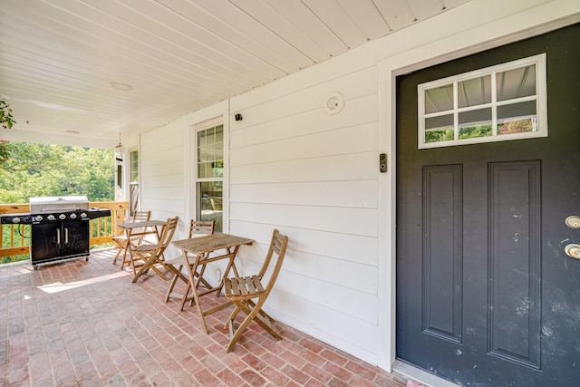 exterior space with area for grilling and a porch