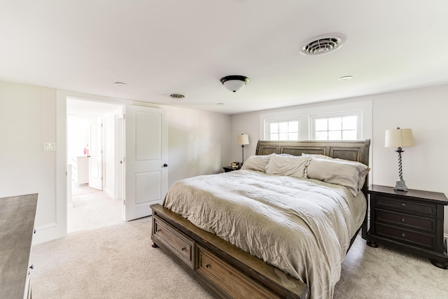 bedroom featuring light colored carpet