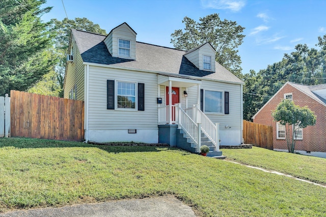 cape cod house with a front yard