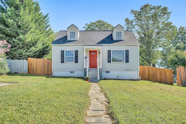 cape cod house with a front lawn