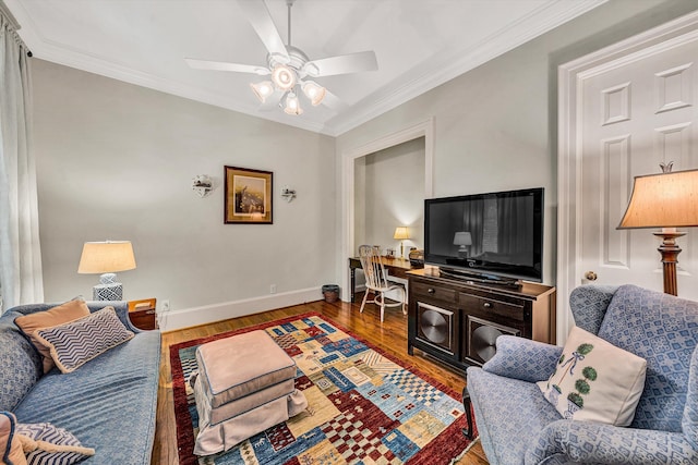 living room featuring hardwood / wood-style floors, ceiling fan, and ornamental molding