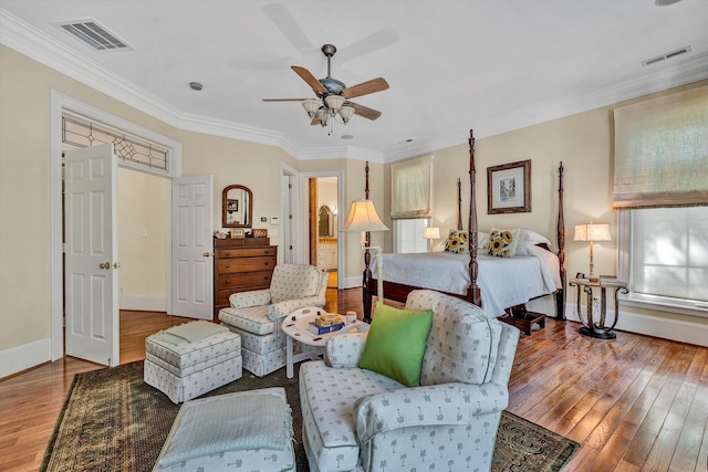 bedroom featuring ornamental molding, hardwood / wood-style floors, and ceiling fan