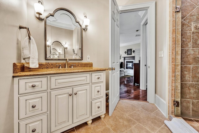 bathroom with wood-type flooring, vanity, an enclosed shower, and crown molding