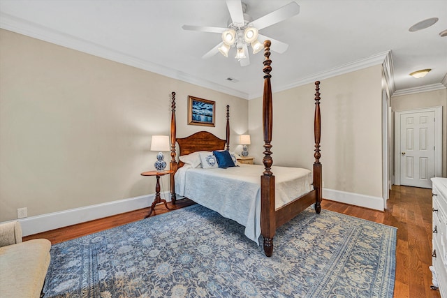 bedroom with hardwood / wood-style flooring, ceiling fan, and ornamental molding