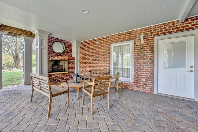 view of patio featuring an outdoor living space with a fireplace