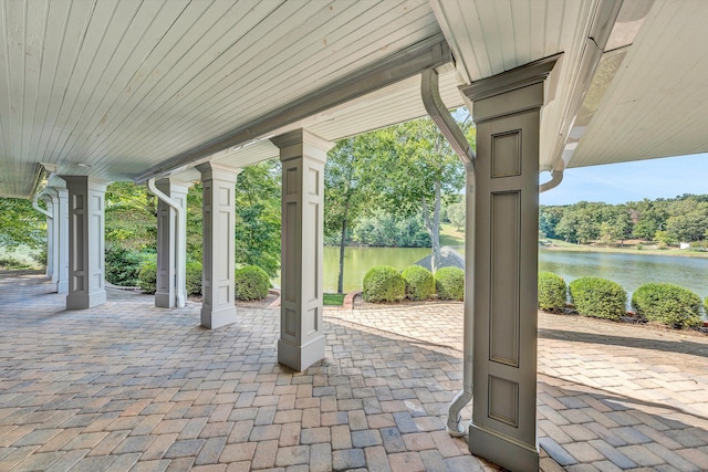 view of patio featuring a water view