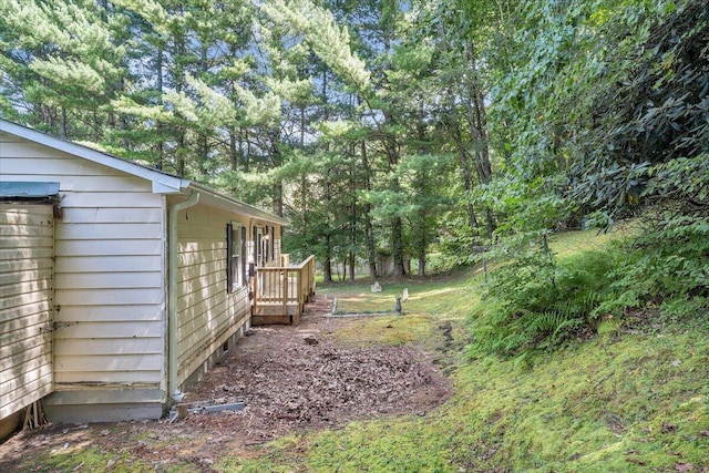 view of yard with a wooden deck