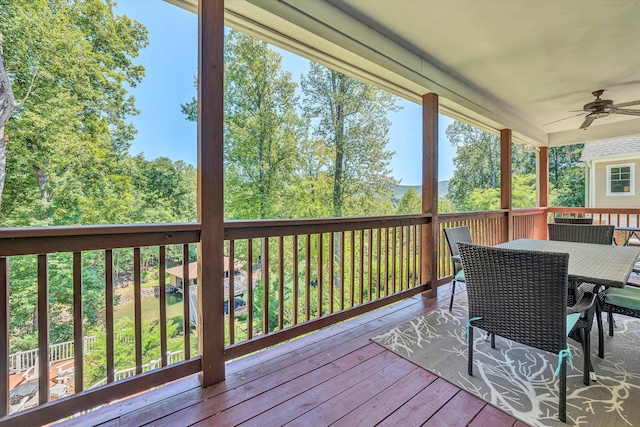 wooden deck featuring ceiling fan