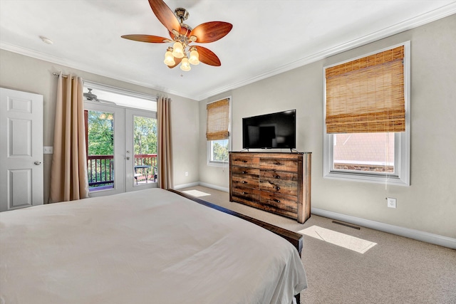 bedroom with ceiling fan, light carpet, and multiple windows