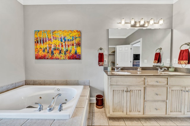 bathroom with crown molding, vanity, and a relaxing tiled tub