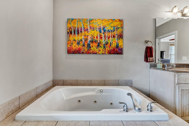 bathroom featuring crown molding, vanity, and a bathtub