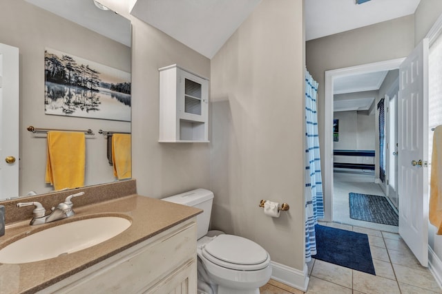 bathroom with tile patterned floors, toilet, curtained shower, and vanity