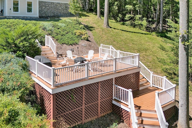 deck featuring a yard and an outdoor fire pit