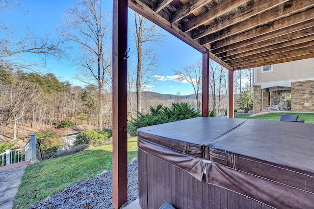 view of patio / terrace featuring a hot tub