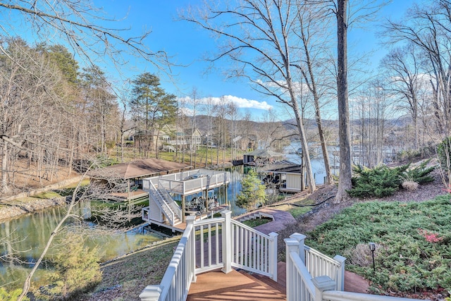 exterior space featuring a deck with water view