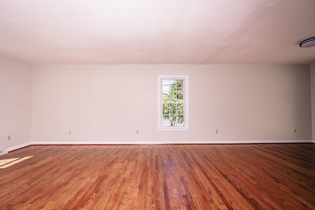 unfurnished room featuring wood-type flooring