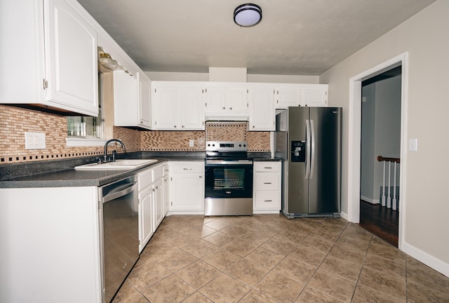 kitchen with sink, white cabinetry, appliances with stainless steel finishes, and ventilation hood