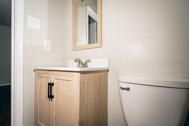 bathroom with toilet and vanity