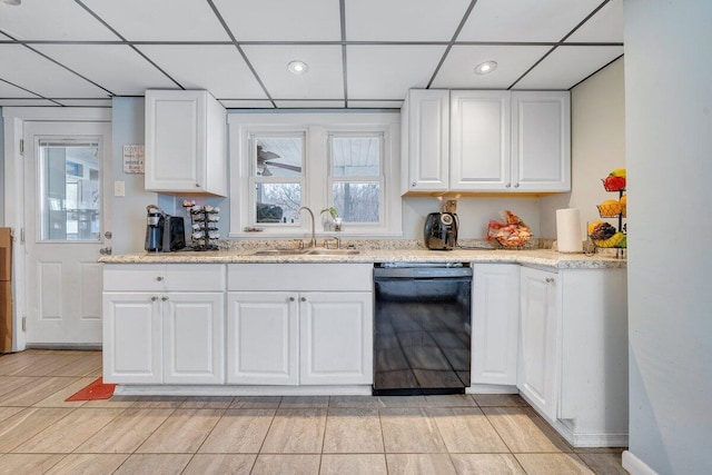 kitchen with sink, white cabinetry, dishwasher, and light stone counters