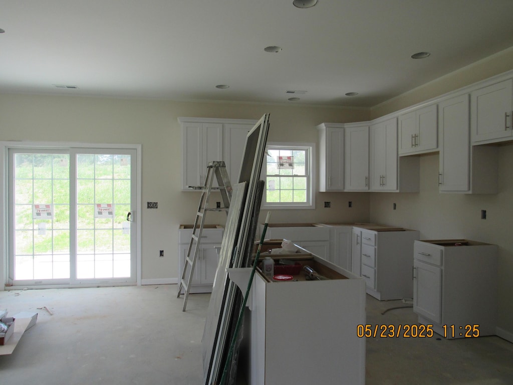 5530 New Pleasant Way, Salem, VA 24153 - kitchen with a kitchen island, white cabinetry, and baseboards