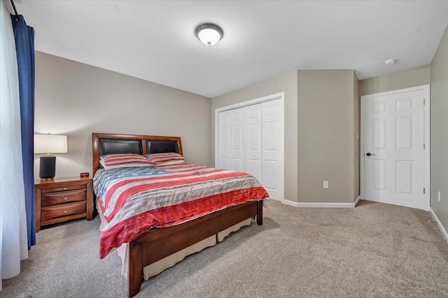 carpeted bedroom featuring a closet