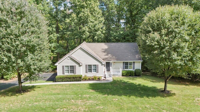 ranch-style home featuring a front yard