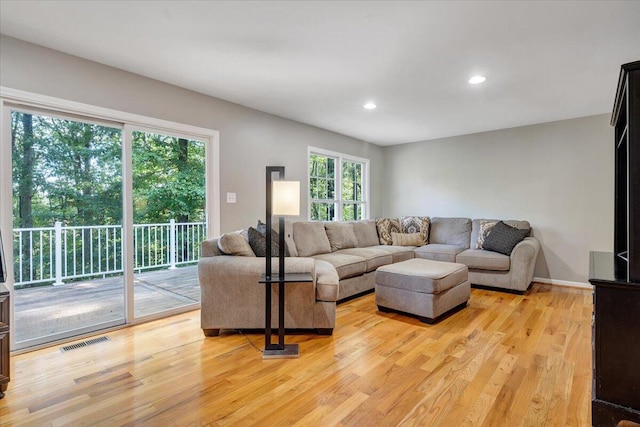 living room with light hardwood / wood-style floors