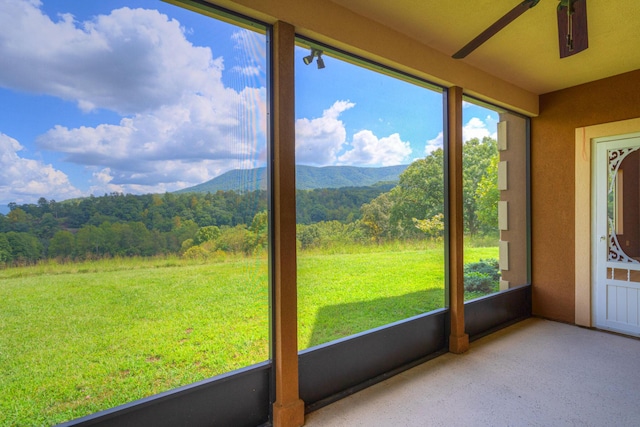 1782 Wolf Creek Rd, Narrows, VA 24124 - unfurnished sunroom with a mountain view, healthy amount of natural light, and a forest view