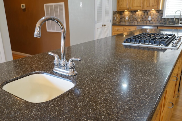 1782 Wolf Creek Rd, Narrows, VA 24124 - kitchen view of appliances with stainless steel finishes, a sink, tasteful backsplash, and dark stone counters