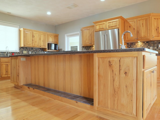 1782 Wolf Creek Rd, Narrows, VA 24124 - kitchen featuring freestanding refrigerator, light wood-type flooring, tasteful backsplash, and recessed lighting