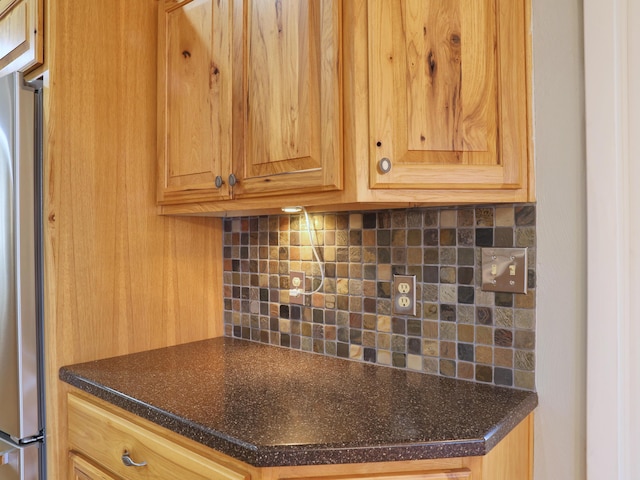 1782 Wolf Creek Rd, Narrows, VA 24124 - kitchen with freestanding refrigerator, backsplash, and dark countertops