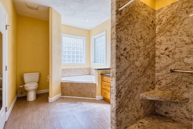 1782 Wolf Creek Rd, Narrows, VA 24124 - bathroom with wood finished floors, toilet, a tile shower, and a bath