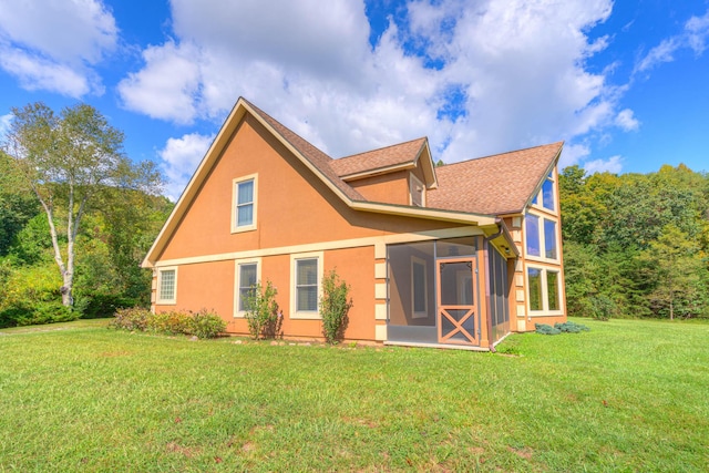 1782 Wolf Creek Rd, Narrows, VA 24124 - rear view of house featuring a sunroom, a lawn, stucco siding, and roof with shingles