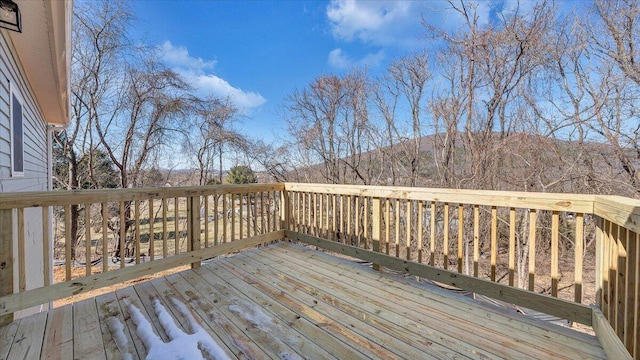 wooden deck with a mountain view