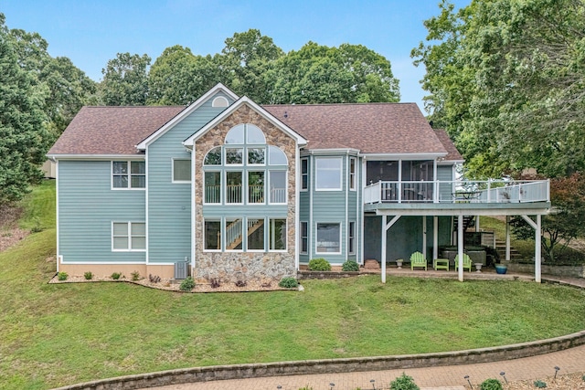 900 Lakemount Dr, Moneta, VA 24121 - back of house featuring a sunroom, a yard, a deck, stone siding, and cooling unit
