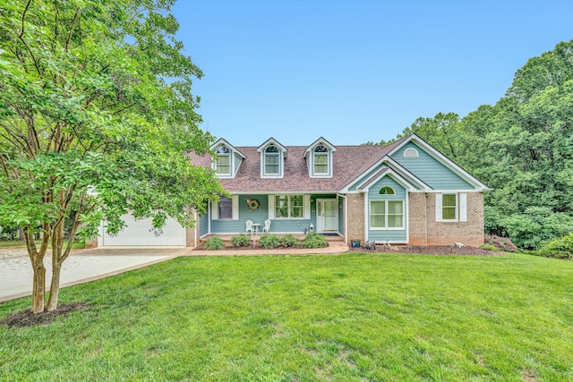 900 Lakemount Dr, Moneta, VA 24121 - cape cod-style house featuring covered porch, driveway, a front yard, and brick siding
