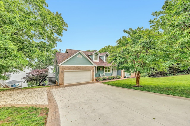 900 Lakemount Dr, Moneta, VA 24121 - view of front facade with concrete driveway, brick siding, an attached garage, a front lawn, and covered porch