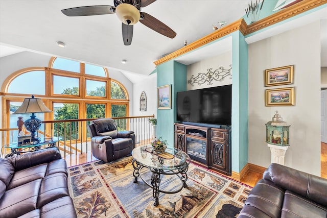 living room featuring wood-type flooring and ceiling fan