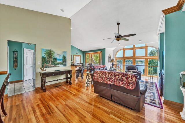 900 Lakemount Dr, Moneta, VA 24121 - living area featuring a ceiling fan, light wood finished floors, baseboards, and high vaulted ceiling