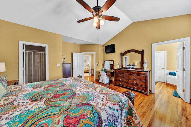 bedroom with lofted ceiling, ceiling fan, light hardwood / wood-style floors, and ensuite bathroom