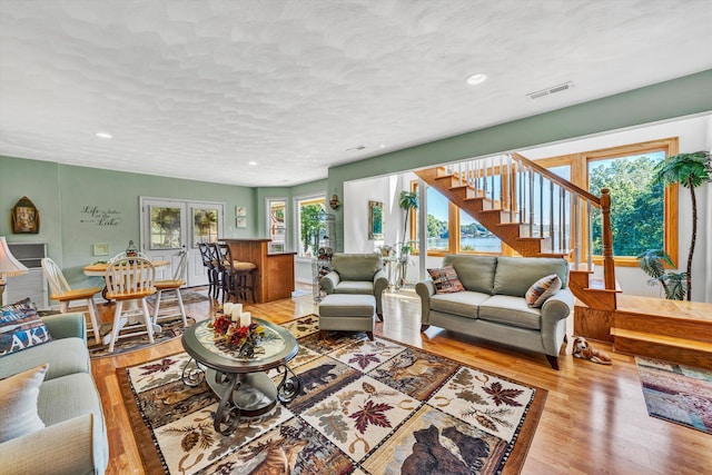 900 Lakemount Dr, Moneta, VA 24121 - living area featuring wood finished floors, stairs, recessed lighting, and a textured ceiling