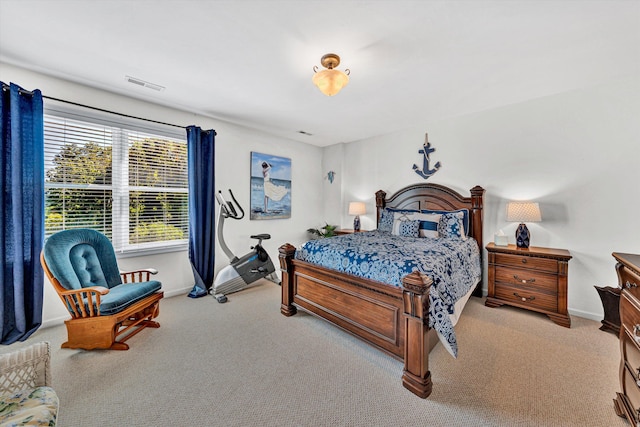 bedroom featuring light colored carpet